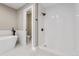 Elegant bathroom featuring a soaking tub, a walk-in shower, and modern fixtures at 46 Douglas Dr, Broomfield, CO 80020