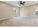 Bright bedroom featuring neutral tones, carpet floors, and ample natural light at 46 Douglas Dr, Broomfield, CO 80020