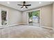 Spacious bedroom with carpeting and natural light, offers a calming atmosphere with access to the backyard at 46 Douglas Dr, Broomfield, CO 80020