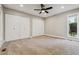 Cozy bedroom with two closets, natural light, and neutral carpeting, creating a relaxing retreat at 46 Douglas Dr, Broomfield, CO 80020