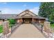 Inviting entrance to a well-maintained building with manicured landscaping and decorative lighting at 46 Douglas Dr, Broomfield, CO 80020