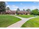 A view of the community building overlooking the green space and walking paths at 46 Douglas Dr, Broomfield, CO 80020