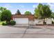 Charming home with a two-car garage, landscaped yard, and well-maintained exterior, creating curb appeal at 46 Douglas Dr, Broomfield, CO 80020