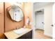 Stylish bathroom featuring a modern vanity, unique mirror, and fixtures at 2001 Lincoln St # 3121, Denver, CO 80202