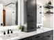 Modern bathroom features double vanity, quartz countertops and stylish black fixtures at 2001 Lincoln St # 3121, Denver, CO 80202