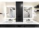 Modern bathroom with double sinks, illuminated mirrors, and a built-in storage tower at 2001 Lincoln St # 3121, Denver, CO 80202