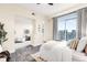 Bright bedroom with ensuite seating area and city views at 2001 Lincoln St # 3121, Denver, CO 80202