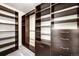 Spacious walk-in closet with custom shelving and drawers offers ample storage at 2001 Lincoln St # 3121, Denver, CO 80202