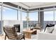 Bright living room with marble fireplace and floor-to-ceiling windows with city views at 2001 Lincoln St # 3121, Denver, CO 80202