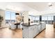 Open-concept living space with dining, living, and kitchen areas with city views at 2001 Lincoln St # 3121, Denver, CO 80202