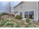 Backyard with wood fence, small greenery, and sliding glass door at 20000 E Mitchell Pl # 39, Denver, CO 80249