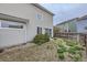 Fenced backyard with minimal ground cover and bush at 20000 E Mitchell Pl # 39, Denver, CO 80249