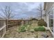 Backyard with a wood fence and limited ground cover at 20000 E Mitchell Pl # 39, Denver, CO 80249