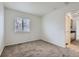 Comfortable bedroom with neutral carpet and natural light at 20000 E Mitchell Pl # 39, Denver, CO 80249