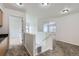 Bright hallway featuring neutral carpet and a staircase leading to the lower level at 20000 E Mitchell Pl # 39, Denver, CO 80249
