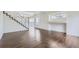 Bright living room with wood floors, white walls, staircase, and natural light at 20000 E Mitchell Pl # 39, Denver, CO 80249