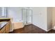 The bright main bathroom includes a soaking tub and glass-enclosed shower at 20000 E Mitchell Pl # 39, Denver, CO 80249