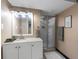 Bright bathroom features a glass door shower, white vanity, and contemporary decor at 1935 W 102Nd Ave, Thornton, CO 80260