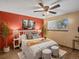 Cozy bedroom featuring unique décor, a ceiling fan and natural light from the window at 1935 W 102Nd Ave, Thornton, CO 80260
