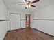 Bedroom with wood flooring and view into the closet and bathroom at 1935 W 102Nd Ave, Thornton, CO 80260