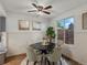 Cozy dining room featuring a modern ceiling fan, hardwood floors, and natural light at 1935 W 102Nd Ave, Thornton, CO 80260