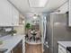 Bright kitchen showcasing stainless steel appliances and an open flow into the dining area at 1935 W 102Nd Ave, Thornton, CO 80260