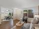 Open-concept living and dining area with modern furnishings and abundant natural light at 1935 W 102Nd Ave, Thornton, CO 80260