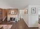 Cozy living room featuring a stone fireplace, wood floors, and warm, inviting decor at 1935 W 102Nd Ave, Thornton, CO 80260