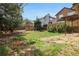 Large backyard with mature trees, shrubs, and privacy fence at 17040 Numa Pl, Parker, CO 80134
