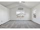 Large bedroom with vaulted ceiling, neutral carpet, and a large window at 17040 Numa Pl, Parker, CO 80134