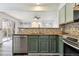 Modern kitchen features stainless appliances, beautiful backsplash, and hardwood floors at 17040 Numa Pl, Parker, CO 80134