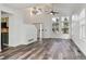 Bright living room features soaring ceilings, large windows, and stunning hardwood floors at 17040 Numa Pl, Parker, CO 80134
