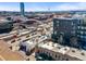 An aerial view of the property showcasing the surrounding cityscape, highways, and neighboring buildings at 2508 Kensing Ct, Denver, CO 80211