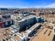 Aerial view of the property showcasing the surrounding neighborhood, amenities, and cityscape in the background at 2508 Kensing Ct, Denver, CO 80211