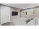 Finished basement bedroom featuring neutral carpet and walls, with a tv and bed at 2508 Kensing Ct, Denver, CO 80211