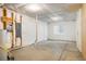 Unfinished basement space with white plastic sheeting, concrete floors, and electrical components ready to be custom designed at 2552 Stonewall Ln, Lafayette, CO 80026
