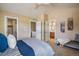 Bedroom featuring a large bed, neutral walls, plush carpet, walk-in closet and ensuite bathroom at 2552 Stonewall Ln, Lafayette, CO 80026