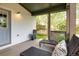 Spacious covered porch with lounge chairs, ideal for enjoying the outdoors in comfort and style at 2552 Stonewall Ln, Lafayette, CO 80026
