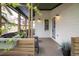 Relaxing covered front porch with comfortable seating, creating a welcoming outdoor space at 2552 Stonewall Ln, Lafayette, CO 80026