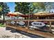 Outdoor dining area featuring BBQ, burgers, and beer signage at a local restaurant at 2552 Stonewall Ln, Lafayette, CO 80026