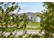 Neighborhood street featuring well-maintained homes with green lawns, shrubbery and mountain views at 2552 Stonewall Ln, Lafayette, CO 80026