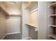 Spacious walk-in closet with shelving and ample storage for clothes and accessories at 2552 Stonewall Ln, Lafayette, CO 80026