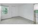 This room has carpet flooring, neutral walls, a large window, and a closet for storage at 10966 W Half Moon Pass, Littleton, CO 80127
