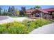 Beautiful community center with colorful flower beds and a well-maintained exterior, perfect for gatherings and events at 10966 W Half Moon Pass, Littleton, CO 80127