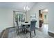 Cozy dining room with a large window and access to the kitchen at 10966 W Half Moon Pass, Littleton, CO 80127