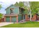 Charming two-story home with a well-maintained lawn and mature trees at 10966 W Half Moon Pass, Littleton, CO 80127