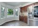 Bright kitchen nook featuring updated cabinets and plenty of natural light at 10966 W Half Moon Pass, Littleton, CO 80127