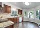 Well-lit kitchen with stainless steel appliances and granite countertops at 10966 W Half Moon Pass, Littleton, CO 80127