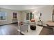 Comfortable living room is bright and cozy with a sliding door to the outdoor deck and a brick fireplace at 10966 W Half Moon Pass, Littleton, CO 80127