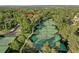 Aerial view of well-maintained tennis courts surrounded by lush greenery, offering a fantastic recreational amenity at 10966 W Half Moon Pass, Littleton, CO 80127